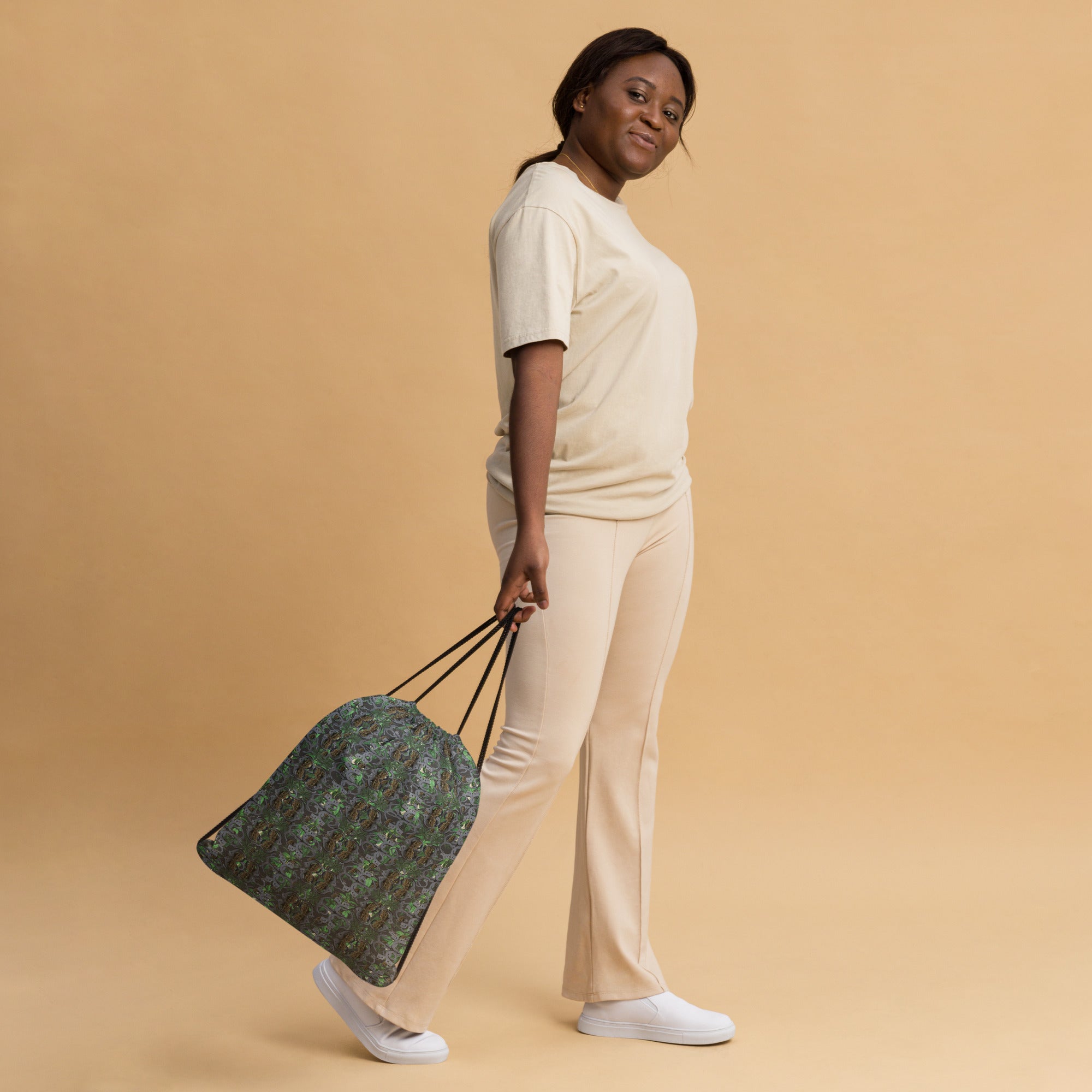 White BudWear drawstring bag with all-over print, featuring a stylish and functional design for casual use.