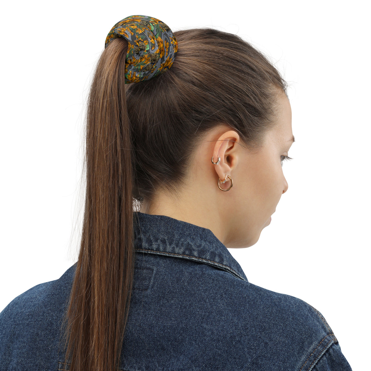All-over-print white Cuffs & Bud Neck Gaiter by BudWear with colorful floral design on fabric.