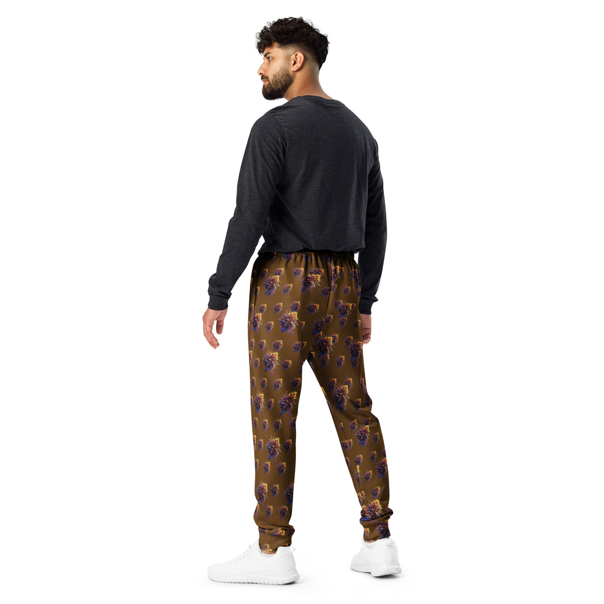 White all-over-print recycled men's cannabis joggers by BudWear, featuring colorful cannabis leaf patterns on a casual cut-sew design.