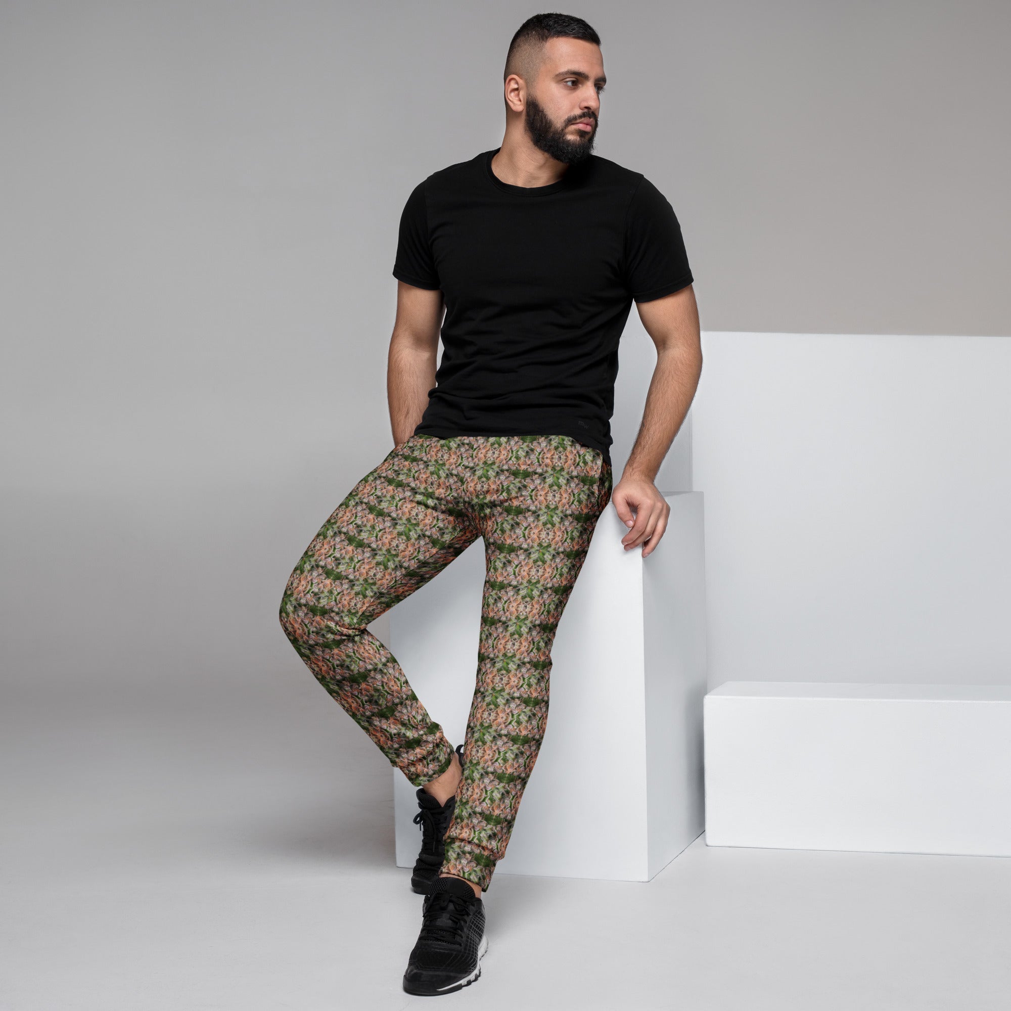 Men's brown cannabis print joggers by BudWear, all-over recycled fabric with a stylish bud pattern on white background.