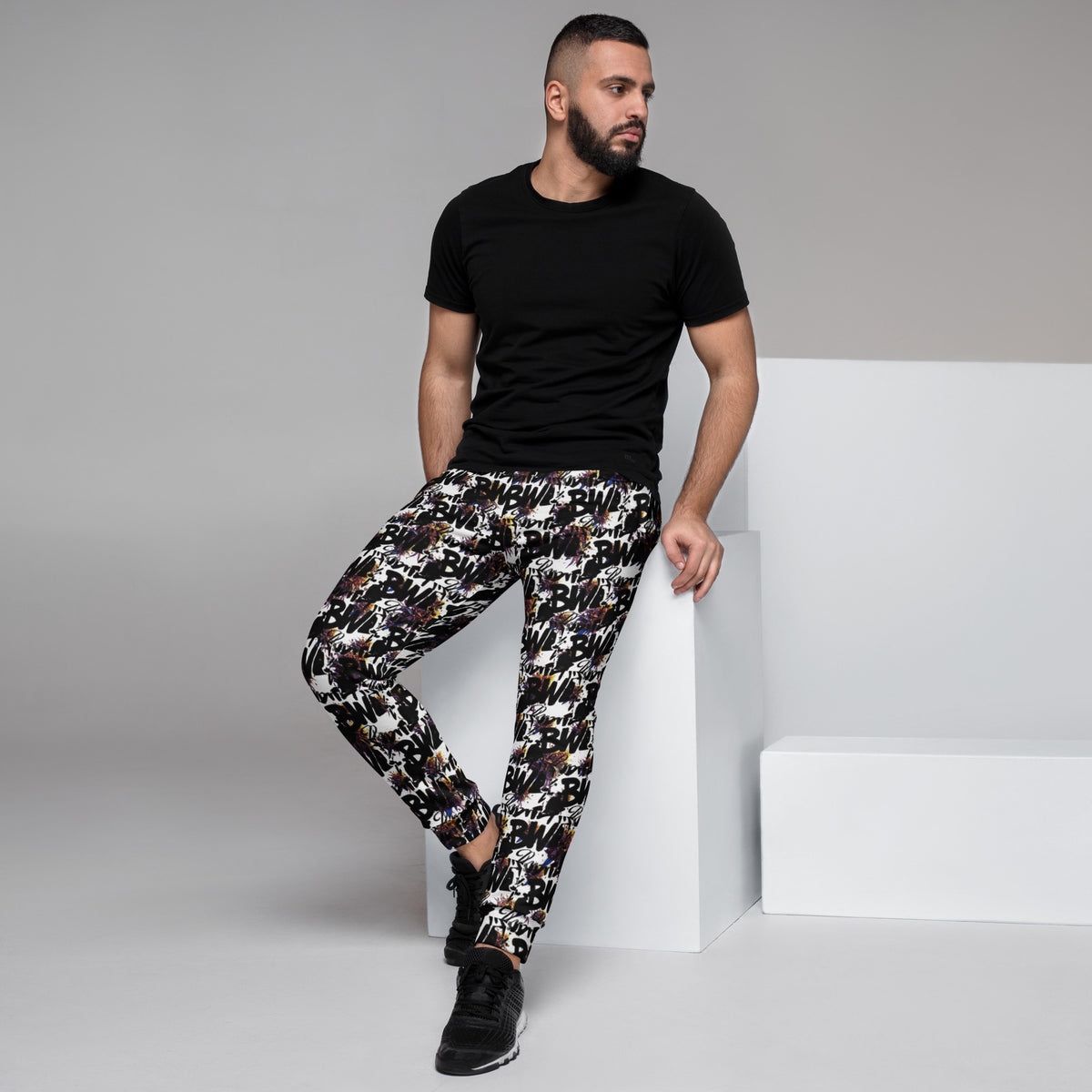 Men's white BudWear all-over-print recycled cotton joggers, featuring a casual fit and vibrant design.