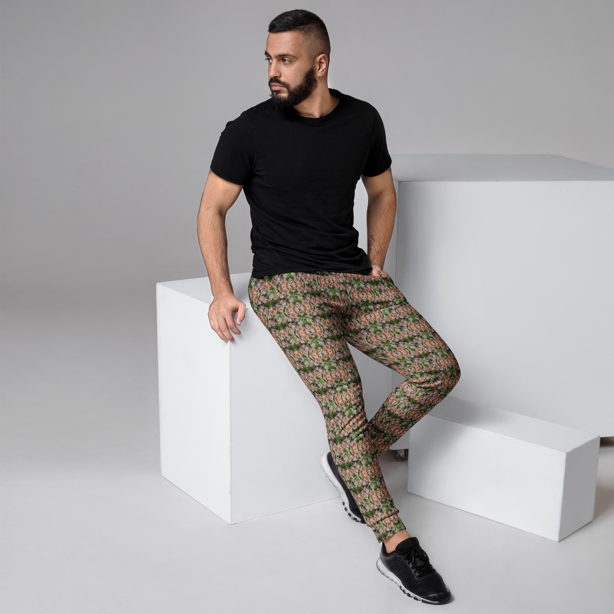 Men's brown cannabis print joggers by BudWear, all-over recycled fabric with a stylish cannabis leaf pattern on white background.