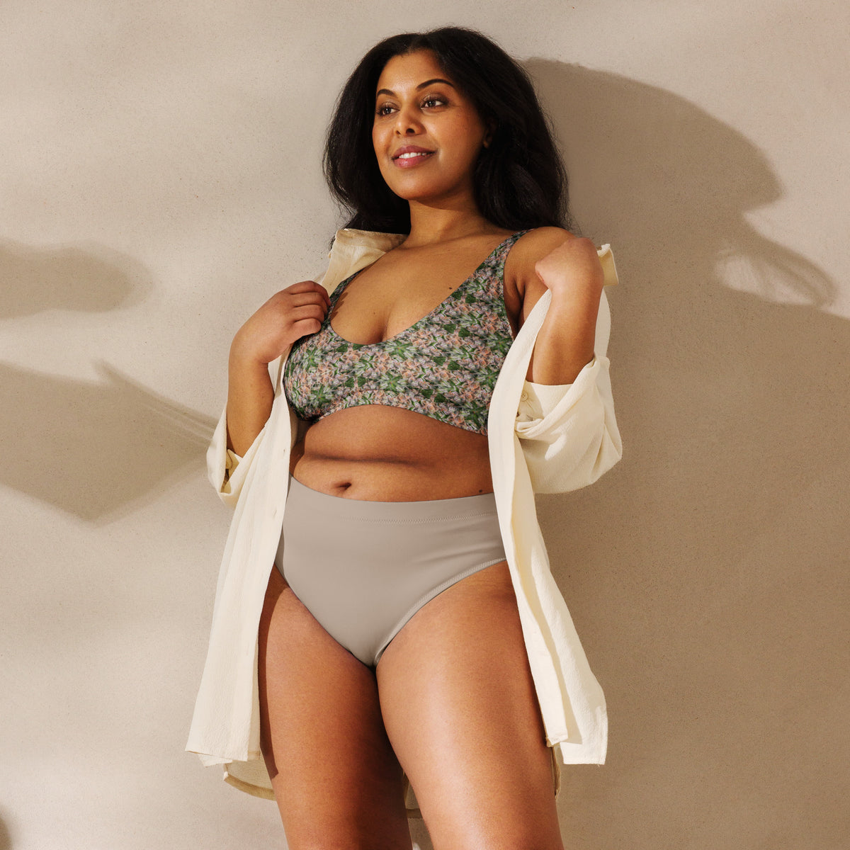 White padded bikini top with all-over BudWear bud design print, featuring supportive straps and recycled fabric for a stylish beach look.