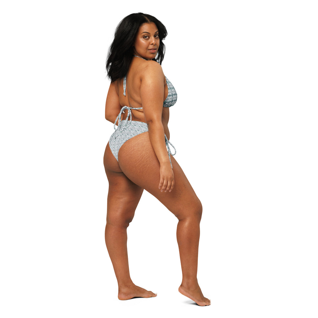 White all-over-print Snow-buddy string bikini by Fancy Canna-buds, featuring recycled fabric and adjustable string ties.