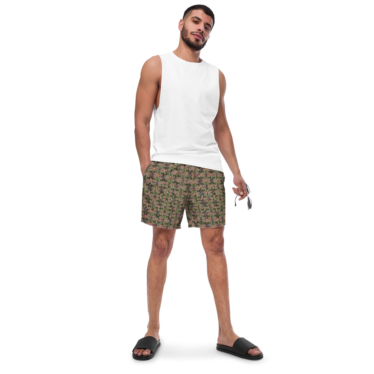 Men's cannabis print swim trunks by BudWear featuring all-over green cannabis leaf design on white recycled fabric.