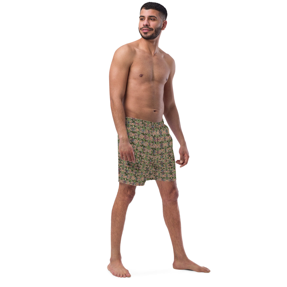 Men's cannabis print swim trunks by BudWear with a white background and all-over green cannabis leaf design.