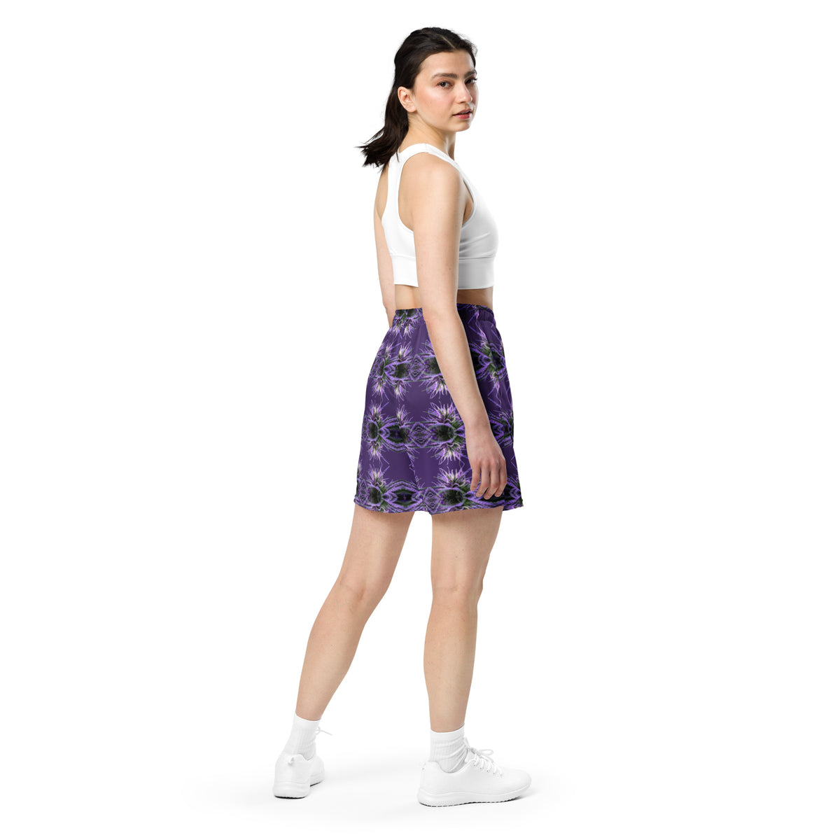 Unisex mesh shorts by BudWear with all-over recycled print, white fabric, showing back view with breathable mesh design.