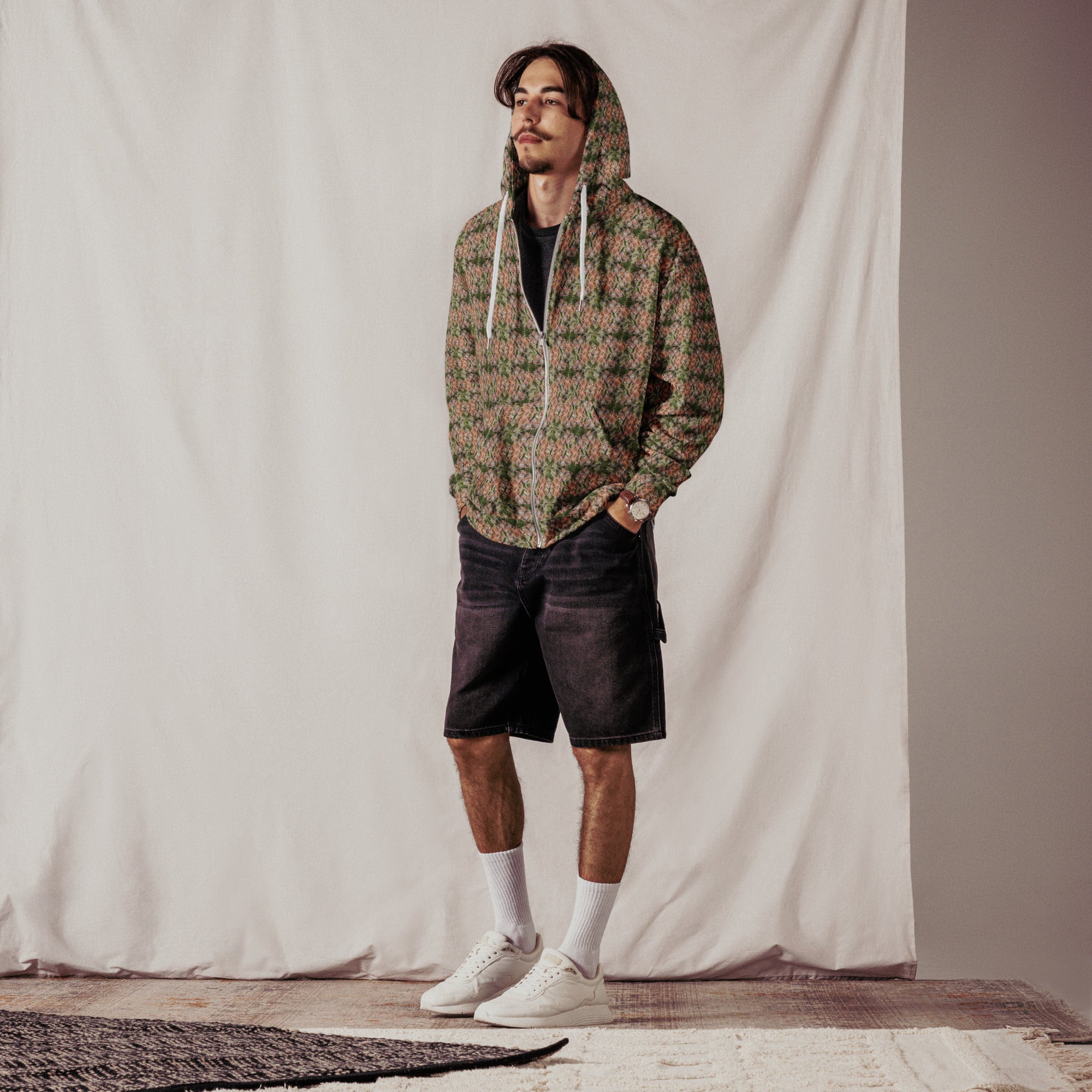 Unisex brown cannabis print zip hoodie by BudWear with all-over recycled cannabis leaf design on front.