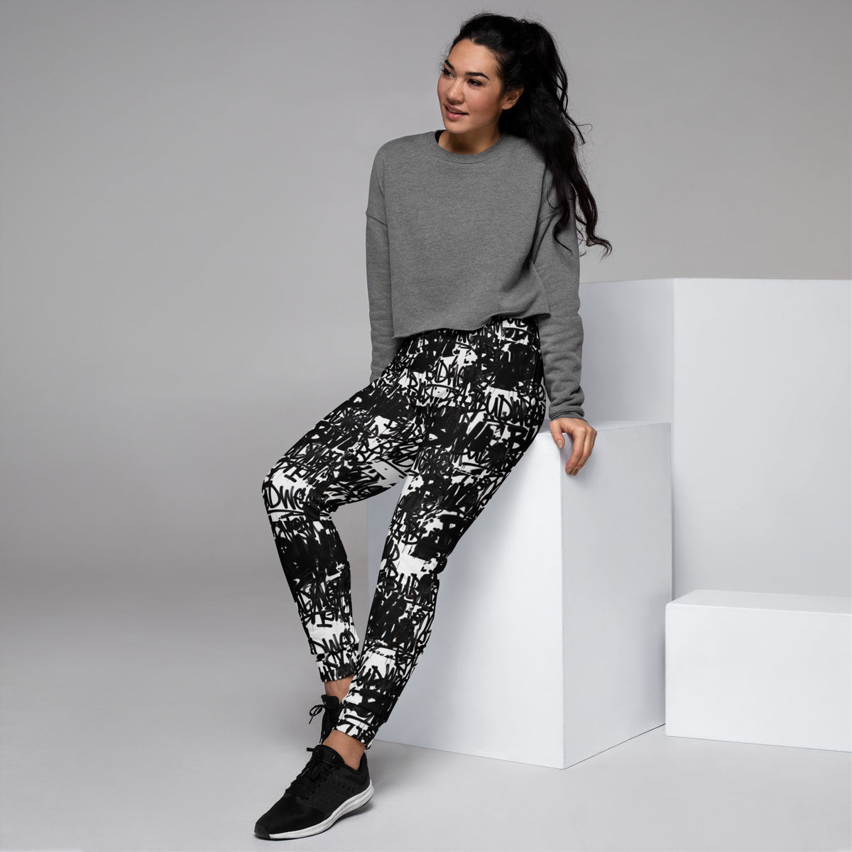 Recycled white women's BudWear signature print joggers with all-over colorful abstract design, casual and comfortable fit.