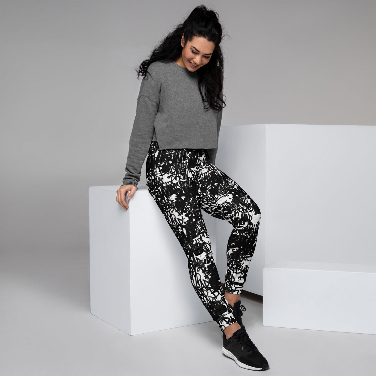 All-over print recycled women's joggers from BudWear featuring a stylish design on white fabric.