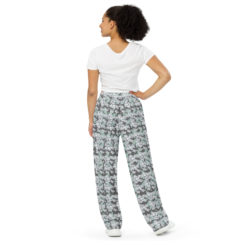Unisex Snow-bud wide-leg pants by BudWear featuring all-over white print and relaxed fit, shown from the back.
