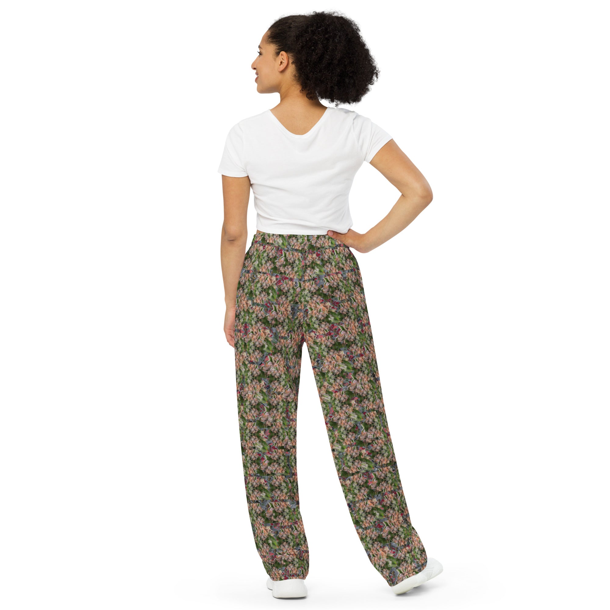 Unisex white wide-leg CUT-SEW pants with all-over colorful BudWear print, full-length back view, relaxed fit.