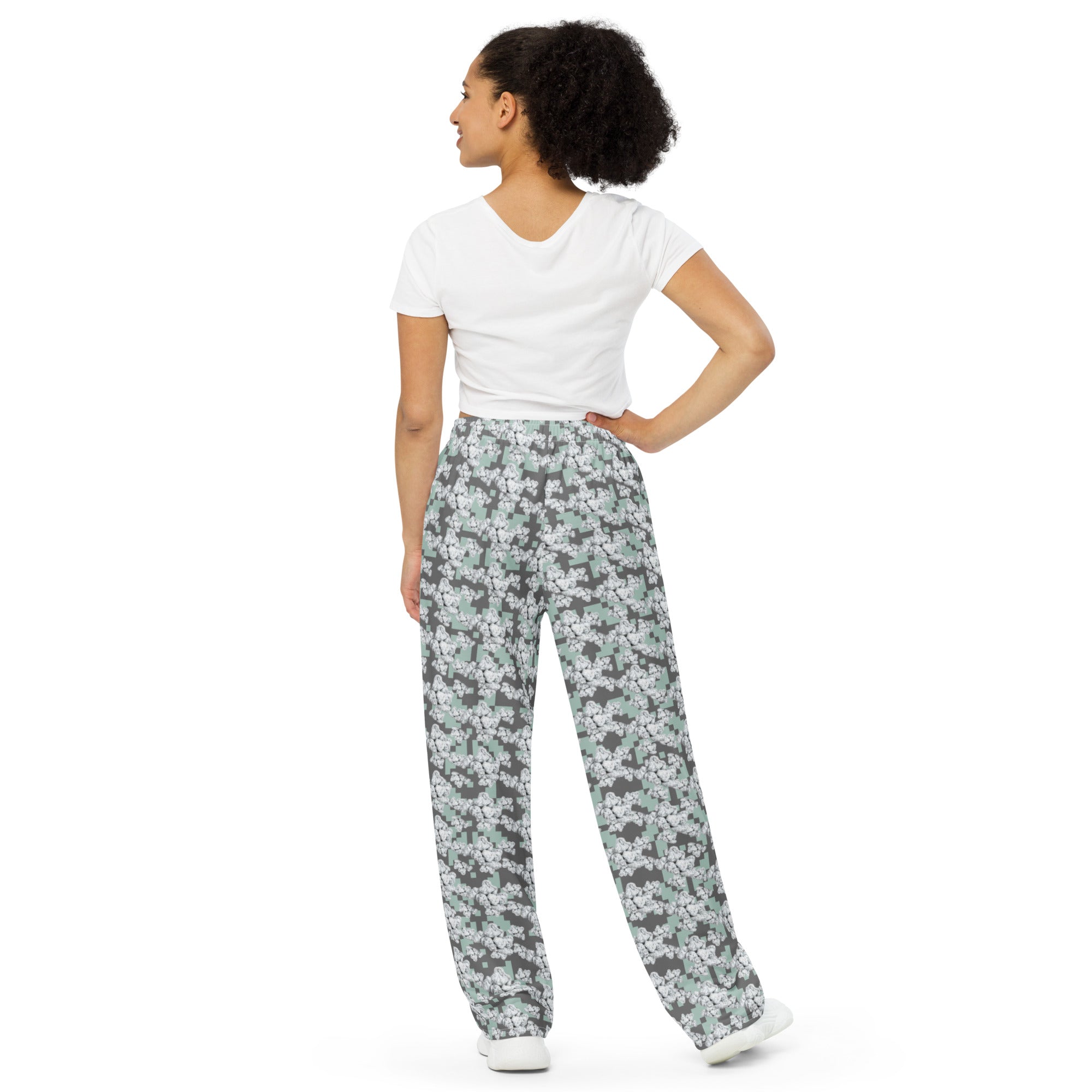 Unisex white wide-leg CUT-SEW pants from BudWear with all-over print, relaxed fit, and back view.