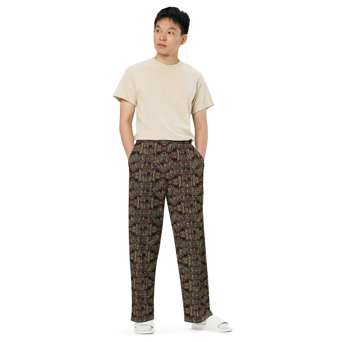 Unisex white wide-leg pants with all-over cannabis print by BudWear, featuring a relaxed fit and casual style.