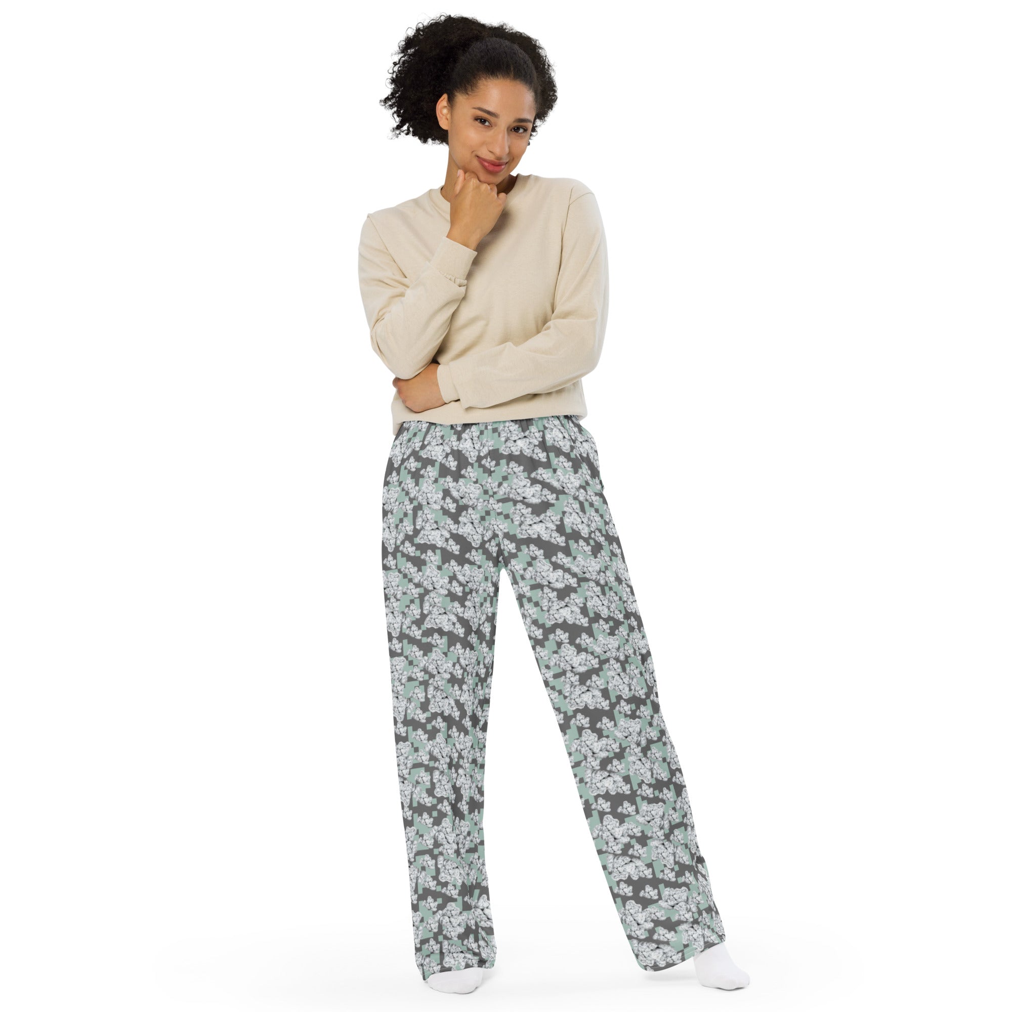 White unisex wide-leg cut-sew pants with all-over print from BudWear, featuring a relaxed fit and casual style.