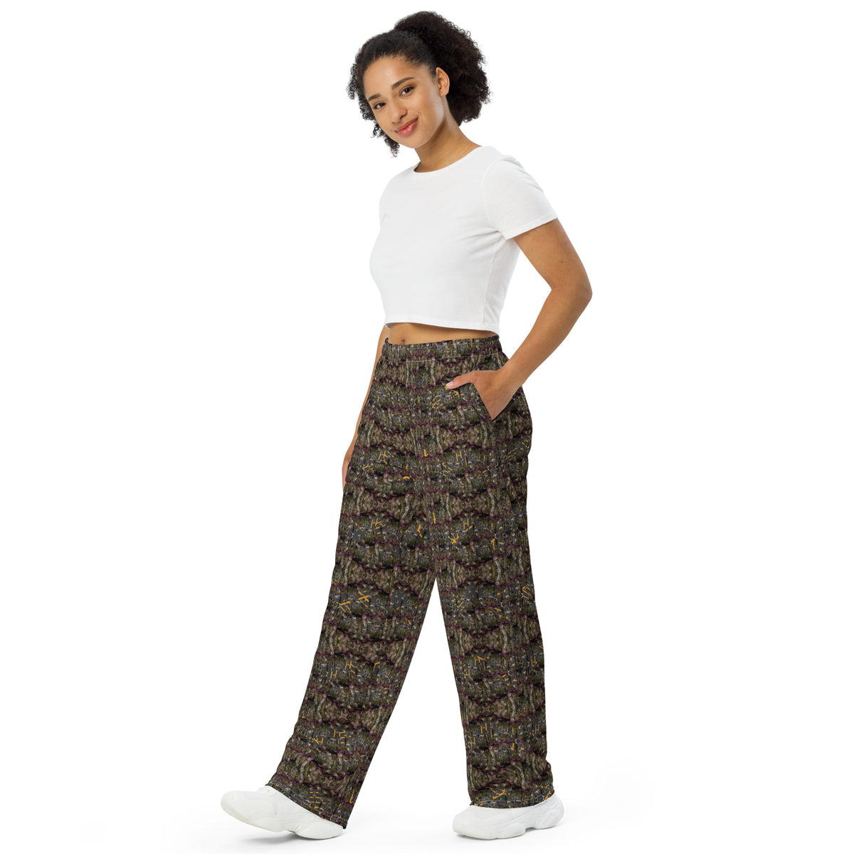 Unisex white wide-leg pants with all-over cannabis print by BudWear, featuring relaxed fit and stylish design.