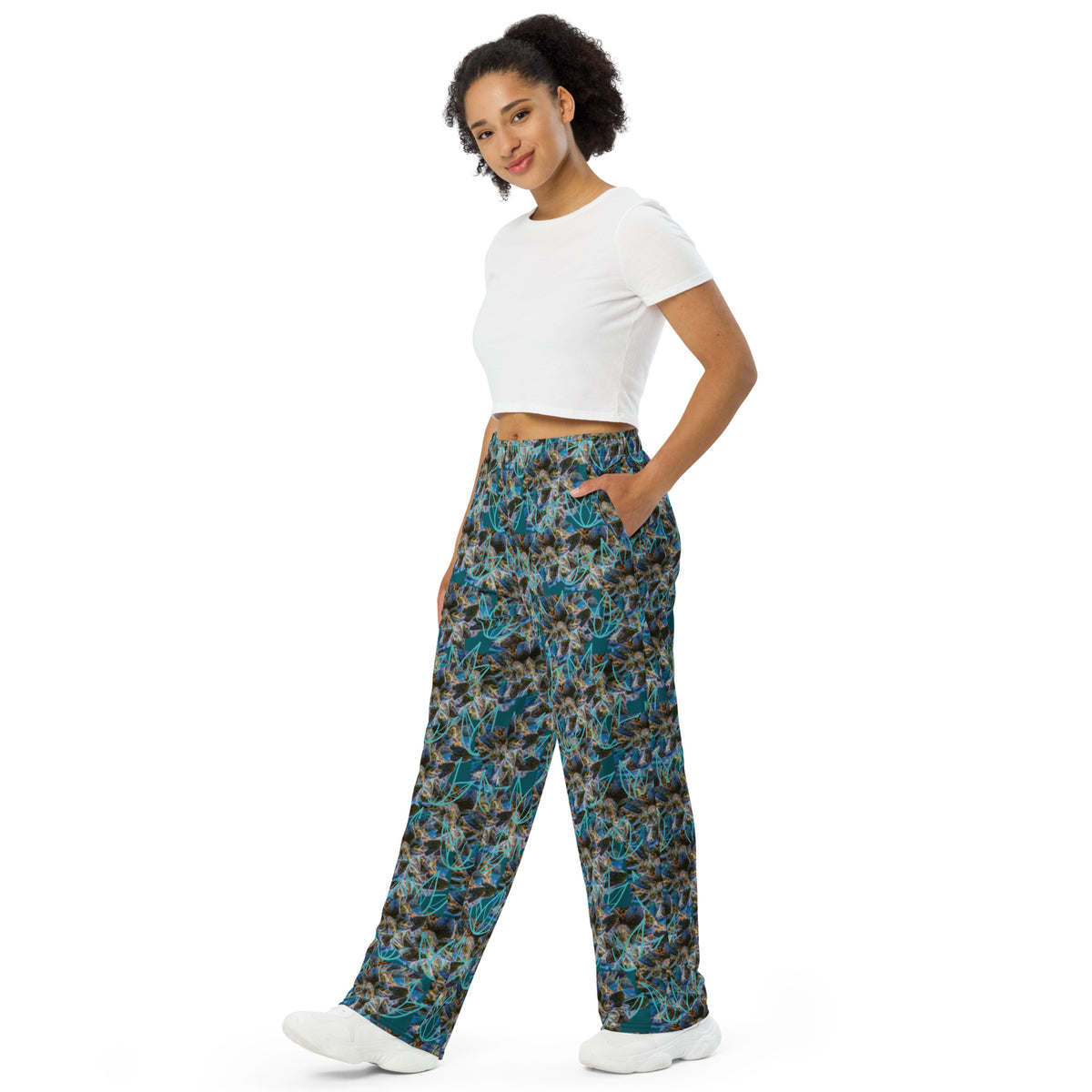 All-over print white wide-leg pants by BudWear, unisex fit with relaxed style, shown from the front.