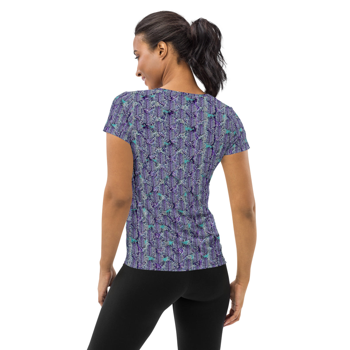 Women's white athletic tee with cannabis leaf print by BudWear, featuring an all-over cannabis-themed pattern on the fabric.