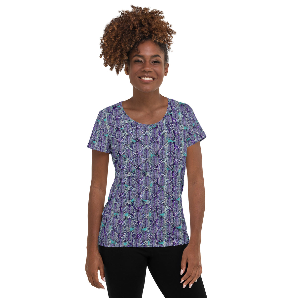 Women's white athletic tee with colorful cannabis print by BudWear, featuring a fitted style and all-over cannabis-themed design.