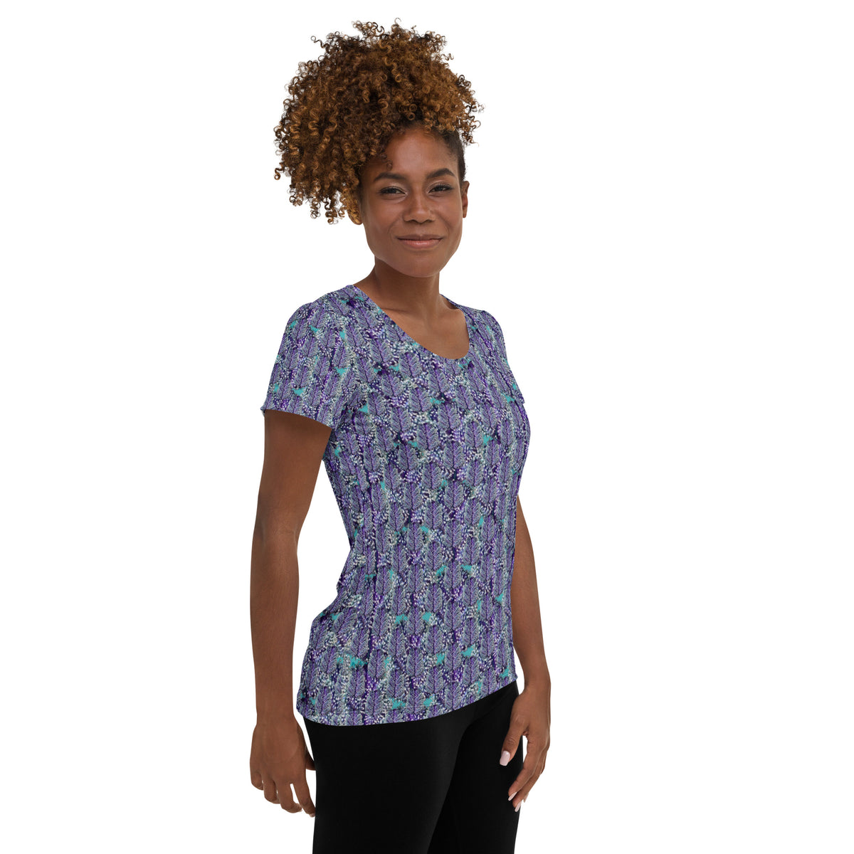 Women's white athletic tee with colorful cannabis print by BudWear, featuring all-over cannabis leaf design for activewear.