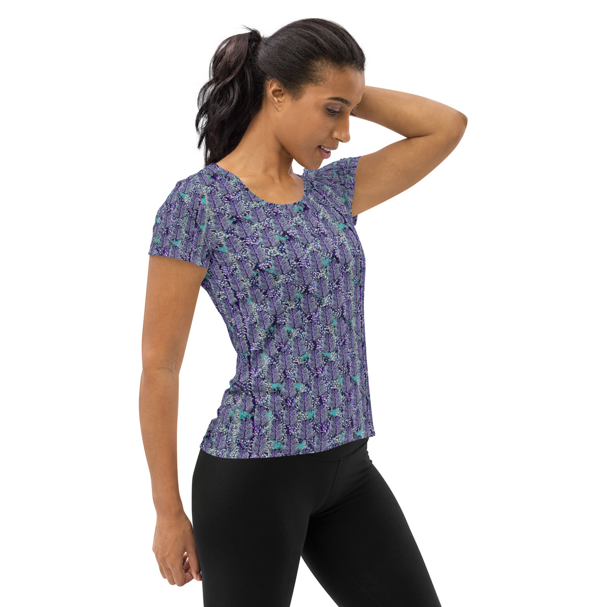 Women's white cannabis print athletic tee by BudWear featuring colorful all-over cannabis leaf design.