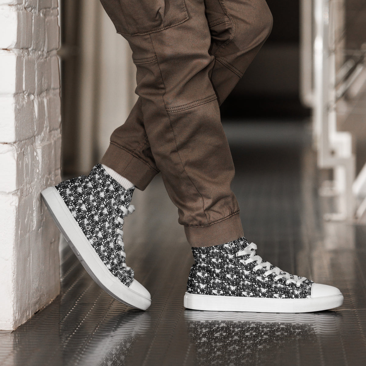 White men's high-top canvas shoes by BudWear, featuring a classic design with white laces and sturdy rubber soles.