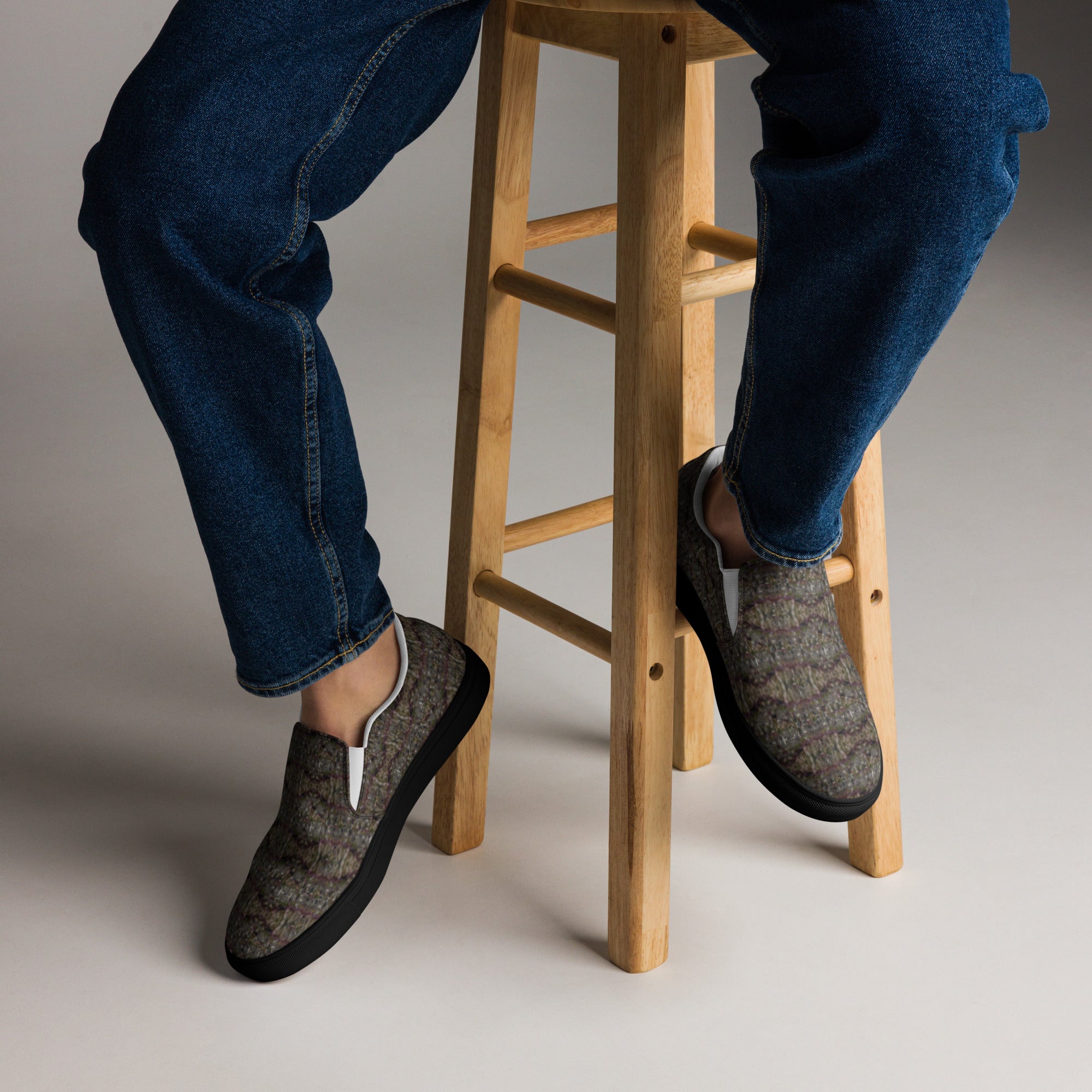 Black Tricoman Canvas Slip-On Shoes by BudWear, men's casual slip-on sneakers with a natural art-inspired design.