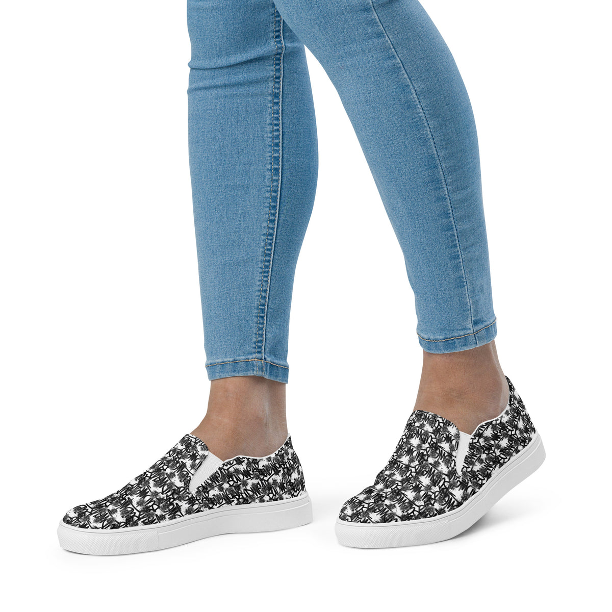 White women's slip-on canvas shoes by BudWear with a sleek, casual design perfect for everyday wear.